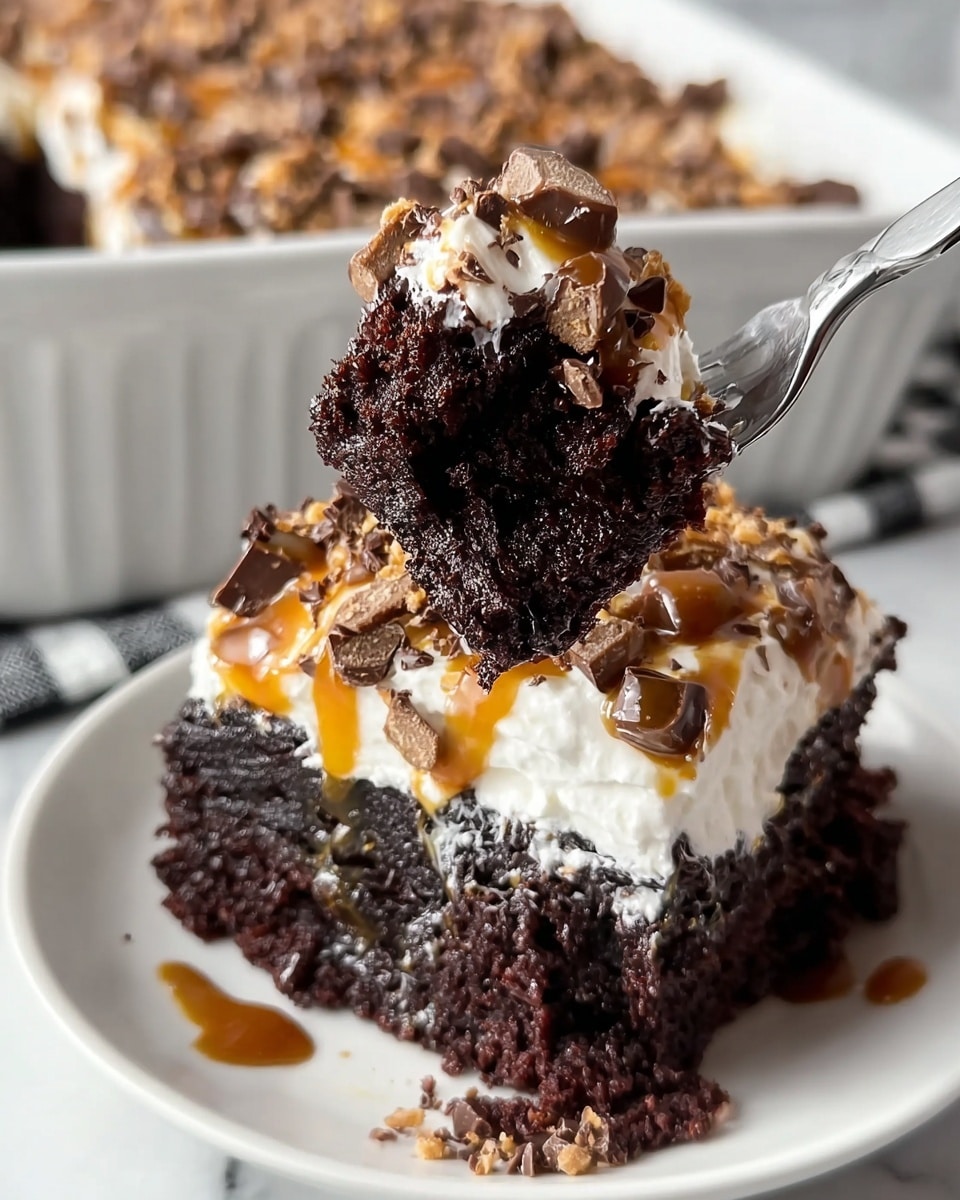A square piece of dark, moist chocolate cake sits on a white plate with a slightly raised dotted edge. The cake has three visible layers: a dense, rich chocolate base soaked with syrup, a thick middle layer of fluffy chocolate cake, and a top layer of smooth white whipped cream. The whipped cream is drizzled with golden caramel sauce and covered with chopped pieces of light brown and dark chocolate candy bits. In the background, a white rectangular ceramic baking dish holds the remaining cake, partially scooped out, resting on a white marbled surface with a black and white checkered cloth partially visible behind it. Photo taken with an iphone --ar 4:5 --v 7